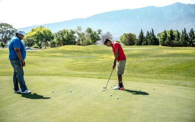 Two men playing golfs
